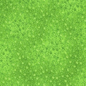 Puede incluir: Una tela verde con un patrón floral blanco. La tela tiene una textura sutil y un fondo verde claro.