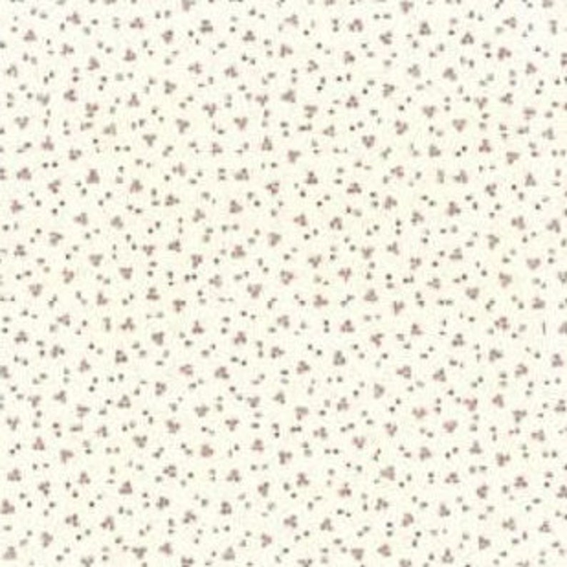 May include: White fabric with a scattered pattern of small, pink, floral shapes.