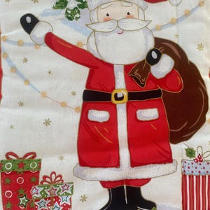 May include: A festive fabric featuring a cartoon Santa Claus in a red suit with a black belt and boots, carrying a sack. The background includes snow, Christmas trees, and wrapped gifts in red and green.