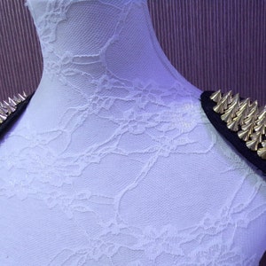 Epaulettes with studs in Gold sold as a pair. Spike gold stud trim, stud trim, shoulder stud trim
