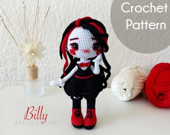 May include: Crochet amigurumi doll pattern for a doll named Billy. The doll is wearing a black dress with a red bow and red shoes. The doll has black hair with red streaks and white skin. The doll is holding a hand to her cheek.
