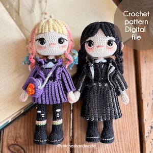 May include: Two handmade crochet dolls, one in a purple outfit with a matching purse and the other in a black outfit. The dolls have yarn hair and are holding hands. The image includes the text "Crochet pattern Digital file" and the Instagram handle "@stitcheshandmade".