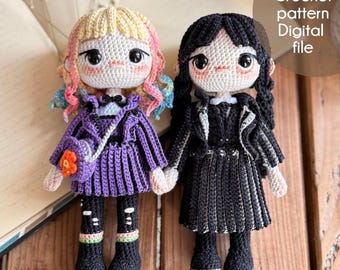 May include: Two handmade crochet dolls, one in a purple outfit with a matching purse and the other in a black outfit. The dolls have yarn hair and are holding hands. The image includes the text "Crochet pattern Digital file" and the Instagram handle "@stitcheshandmade".