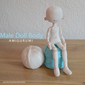 May include: White crocheted amigurumi doll body sitting on a blue yarn ball. The doll has a simple face and is sitting with its legs crossed. The text "Male Doll Body" and "AMIGURUMI" is visible in the image. The text "@stitcheshandmade" is visible at the bottom of the image.