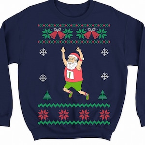 May include: Navy blue Christmas sweater with a white, red, and green pattern. The sweater features a cartoon image of Santa Claus running with the number "1" on his shirt.