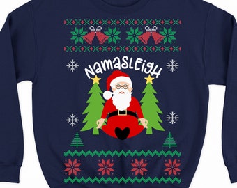 May include: Navy blue Christmas sweater with a white, red, and green pattern. The sweater features a cartoon image of Santa Claus meditating with the text "Namasleigh".