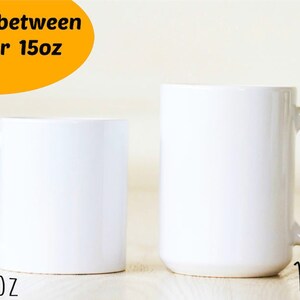 May include: Two white ceramic mugs, one 11 oz and one 15 oz, side by side on a light wood surface. Choose between 11 oz or 15 oz.