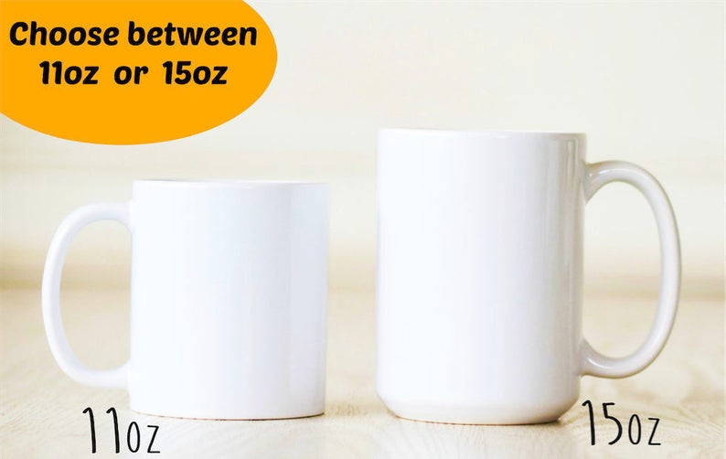 May include: Two white ceramic mugs, one 11 oz and one 15 oz, side by side on a light wood surface. Choose between 11 oz or 15 oz.