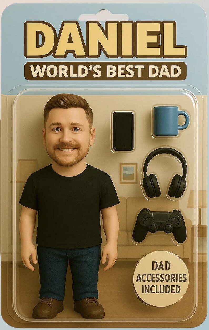 May include: A figurine of a man in a black t-shirt and blue jeans, with the text "DANIEL WORLD'S BEST DAD". Accessories include a phone, mug, headphones, and game controller. "DAD ACCESSORIES INCLUDED" is also printed on the packaging.