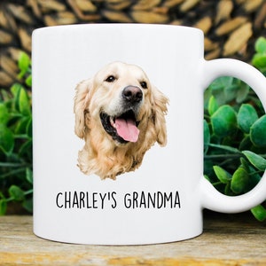 May include: White ceramic mug with a golden retriever dog illustration and the text "CHARLEY'S GRANDMA" printed on it.