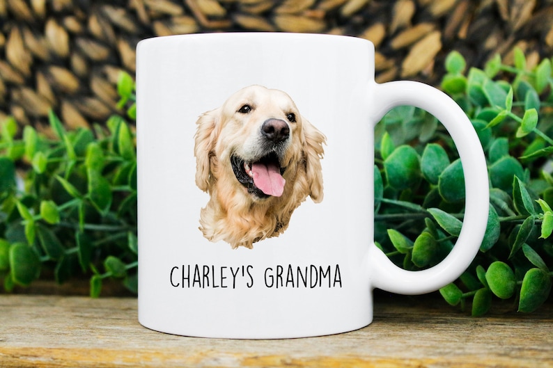 May include: White ceramic mug with a golden retriever dog illustration and the text "CHARLEY'S GRANDMA" printed on it.