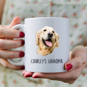 May include: White ceramic mug with a golden retriever dog image and the text "CHARLEY'S GRANDMA" printed on it.