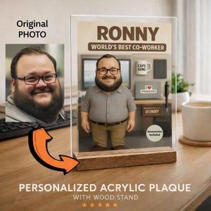 May include: A personalized acrylic plaque with a wooden stand. The plaque features a cartoon image of a man with the text "RONNY WORLD'S BEST CO-WORKER". Additional text includes "CAFE KING", "SPREADSHEETS", and "Accessories Included".