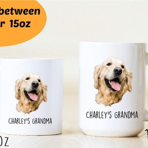 May include: Two white ceramic mugs with a golden retriever dog image and the text "CHARLEY'S GRANDMA". The mug on the left is 11 oz and the mug on the right is 15 oz.