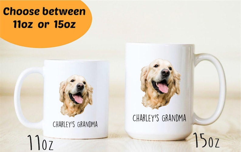 May include: Two white ceramic mugs with a golden retriever dog image and the text "CHARLEY'S GRANDMA". The mug on the left is 11 oz and the mug on the right is 15 oz.