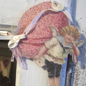 Paper figure child angel with Easter egg, nostalgic, vintage, handmade, Easter decoration