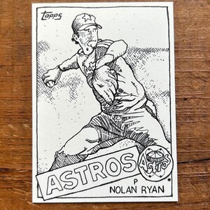 May include: Black and white line drawing of a baseball player pitching. The player is wearing a baseball cap with a star on it and a jersey with the word "Astros" on it. The text "Nolan Ryan" is below the image.
