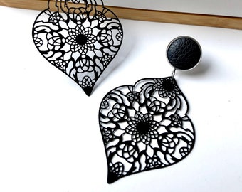 Black filigree earrings with 12mm leather stud. Hypoallergenic stainless steel. Butterfly back.