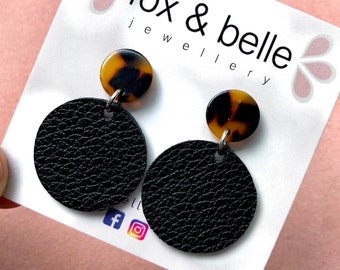 Leather earrings in black beauty with tortoise shell resin stud. Stainless steel post. Hypoallergenic. Light weight earring. 12mm stud.
