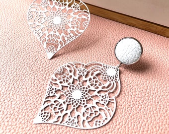 White filigree earrings with 12mm leather stud. Hypoallergenic stainless steel. Butterfly back.