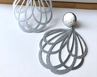 Silver tulip filigree dangle earrings with a silver 12mm leather stud. Hypoallergenic stainless steel. Butterfly back.