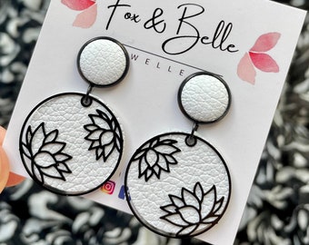 Leather dangle earrings- lotus in white with black. Stainless steel post. Hypoallergenic. Light weight earring. 12mm stud.