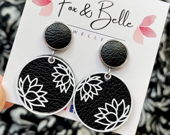 Leather dangle earrings- lotus in black with white. Stainless steel post. Hypoallergenic. Light weight earring. 12mm stud.