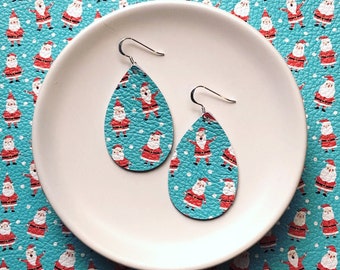 Leather Earrings- Mini Drop in Santa baby print. Hypoallergenic sterling silver hooks. Light weight earrings.