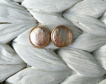 Rose Gold Leather studs in rose gold. Hypoallergenic surgical stainless steel bezel.
