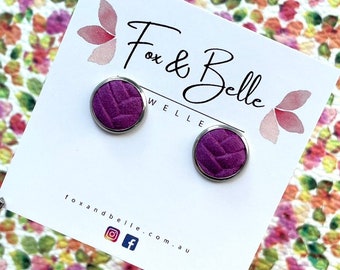 Leather studs in dark magenta braided print. Hypoallergenic surgical stainless steel bezel. Purple studs. Braided studs.