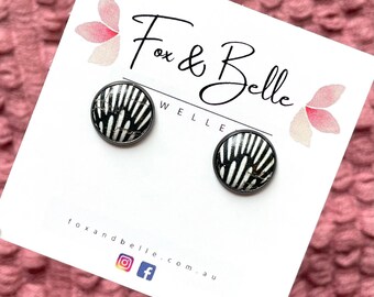 Cork studs in Art Deco print. Black and white studs. Hypoallergenic surgical stainless steel bezel. Unique studs. Monochrome studs.