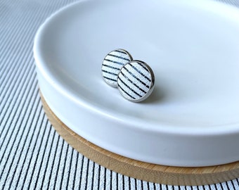 Leather studs in black and white stripe print. Hypoallergenic surgical stainless steel bezel.