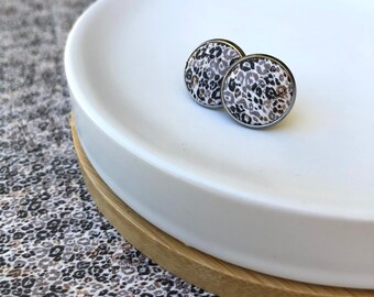 Cork studs in mini leopard print. Hypoallergenic surgical stainless steel bezel.