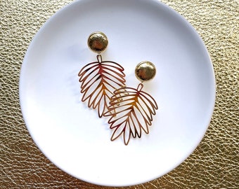 Gold tropical palm dangle earrings with 10mm leather stud. Hypoallergenic stainless steel. Gold dangle earrings. Butterfly back.