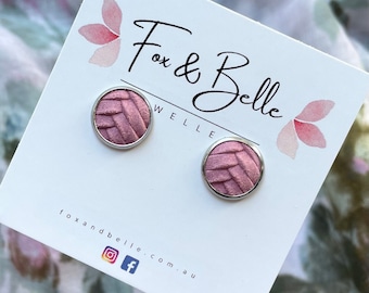 Leather studs in pink braided print. Hypoallergenic surgical stainless steel bezel. Pink studs. Braided studs.