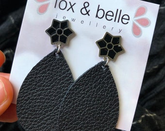 Leather earrings in Midnight star. Star stud earring with your choice of large or small leather tear drop. Hypoallergenic stainless steel.