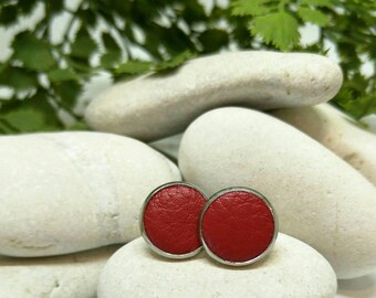 Leather studs in racy red print. Hypoallergenic surgical stainless steel bezel.