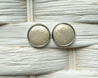 Leather studs in vanilla sparkle print. Hypoallergenic surgical stainless steel bezel.