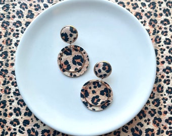 Large leather dangle earrings in peach, tan and orange leopard with rose gold hoop. Stainless steel post. Hypoallergenic.