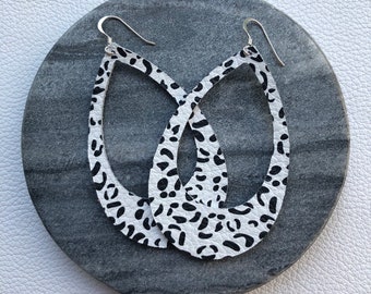 Leather Earrings- Silhouette snow leopard print. Hypoallergenic sterling silver hooks. Light weight earrings.