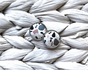 Leather studs in Granite print. Hypoallergenic surgical stainless steel bezel.
