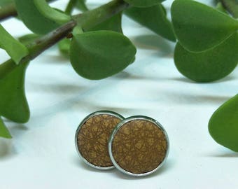 Leather studs in caramel print. Hypoallergenic surgical stainless steel bezel.