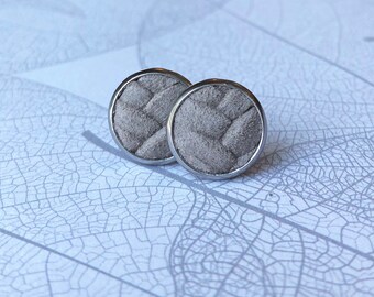 Leather studs in stonewash Taupe braided print. Hypoallergenic surgical stainless steel bezel.