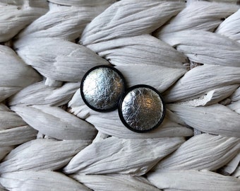 Black leather Studs in silver. Hypoallergenic surgical stainless steel bezel.