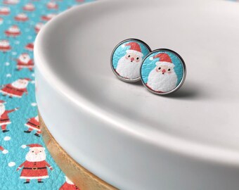 Leather studs in Santa Claus print. 10mm. Hypoallergenic surgical stainless steel bezel.