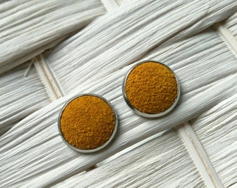 Leather studs in mustard suede print. Hypoallergenic surgical stainless steel bezel.