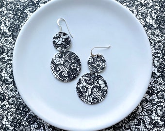 Leather dangle earrings in black & white lace. Double leather circles. Sterling silver hooks. Hypoallergenic. Light weight earring.