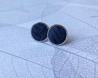 Leather studs in navy blue braided print. Hypoallergenic surgical stainless steel bezel.