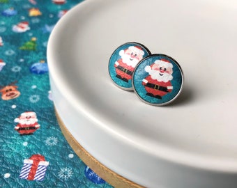 Leather studs in Father Christmas print. 14mm. Hypoallergenic surgical stainless steel bezel.