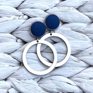 Hoop Studs featuring a 12mm leather stud with a stainless steel silver hoop. Choose the leather you would like. All hypoallergenic.